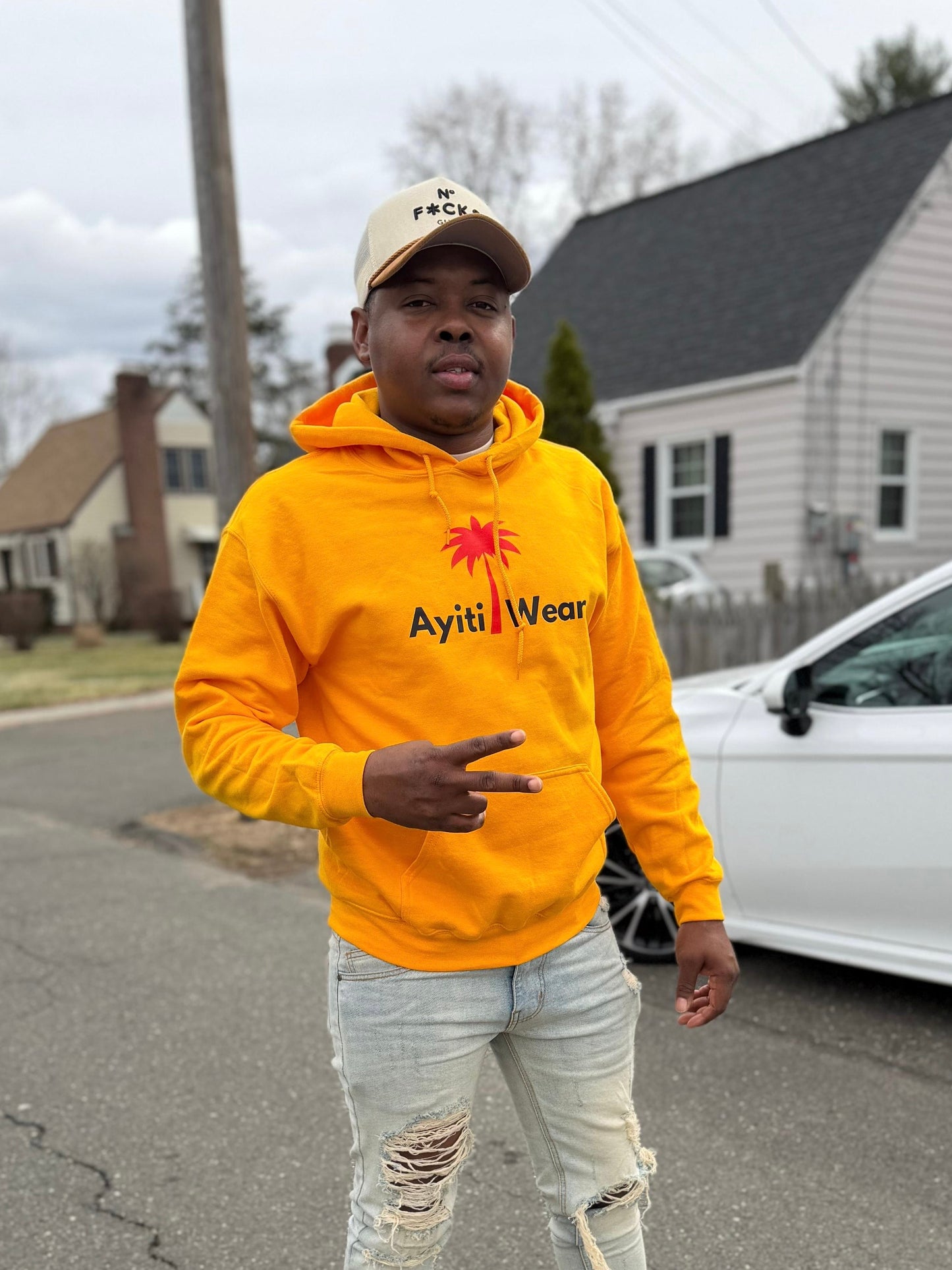 yellow hoodie custom with AyitiWear logo