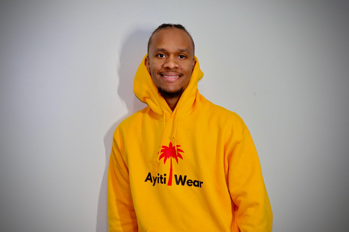 yellow hoodie custom with AyitiWear logo